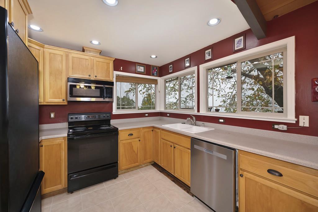 2930 Holloway Drive Georgetown, CA 95634 - Photo 23 of 93 a kitchen with stainless steel appliances granite countertop a refrigerator a sink a stove top oven and a refrigerator