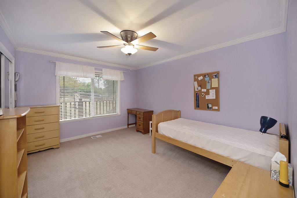 2930 Holloway Drive Georgetown, CA 95634 - Photo 25 of 93 a bedroom with a bed and a chandelier