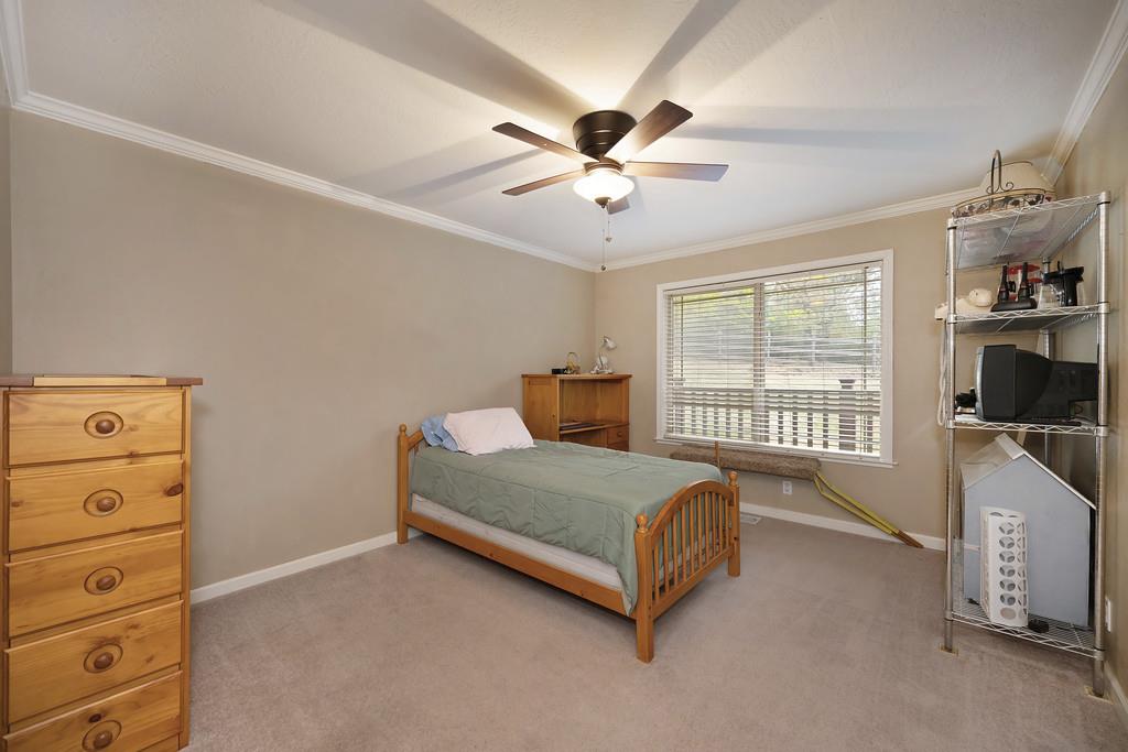 2930 Holloway Drive Georgetown, CA 95634 - Photo 28 of 93 a bedroom with a bed a window and dresser