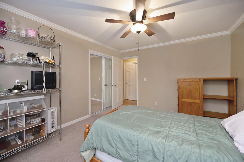2930 Holloway Drive Georgetown, CA 95634 - Photo 29 of 93 a bedroom with a bed and a flat tv screen on the dresser