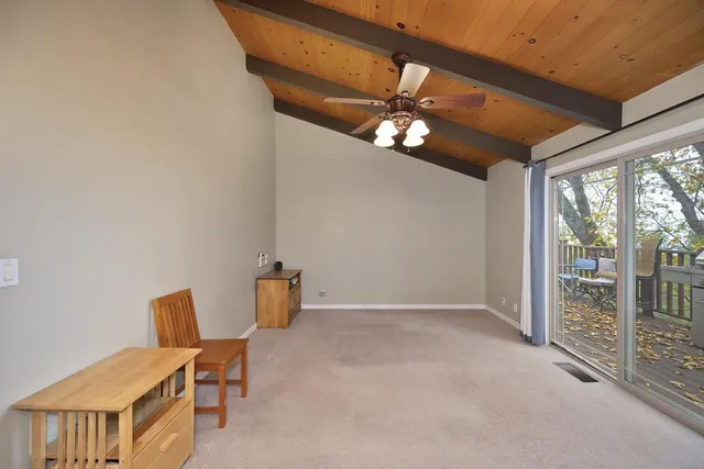 a view of a chair and table on the wooden floor