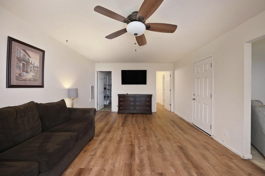 2930 Holloway Drive Georgetown, CA 95634 - Photo 38 of 93 a living room with furniture and a flat screen tv