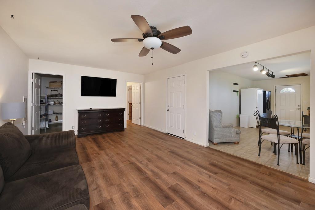 2930 Holloway Drive Georgetown, CA 95634 - Photo 39 of 93 a living room with furniture a fireplace and a flat screen tv