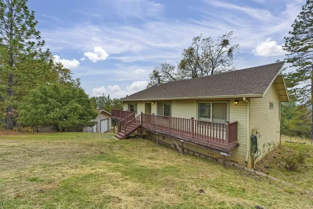 a bath tub sitting in a bathroom next to a window