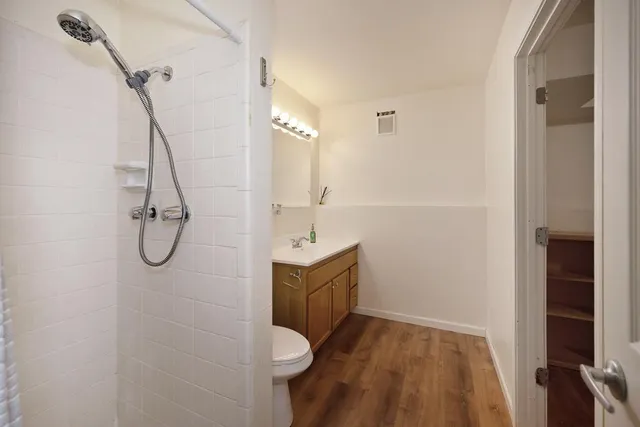 a view of a patio with iron fence