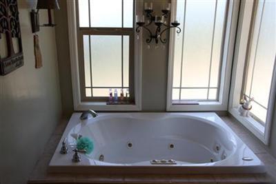 2930 Holloway Drive Georgetown, CA 95634 - Photo 10 of 93 a bath tub sitting in a bathroom next to a window