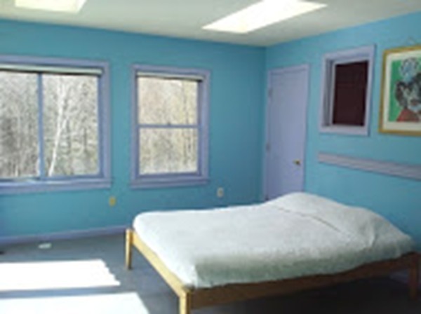 180 South Ashfield Road Conway, MA 01096 - Photo 17 of 30 a bed sitting in a bedroom next to a window