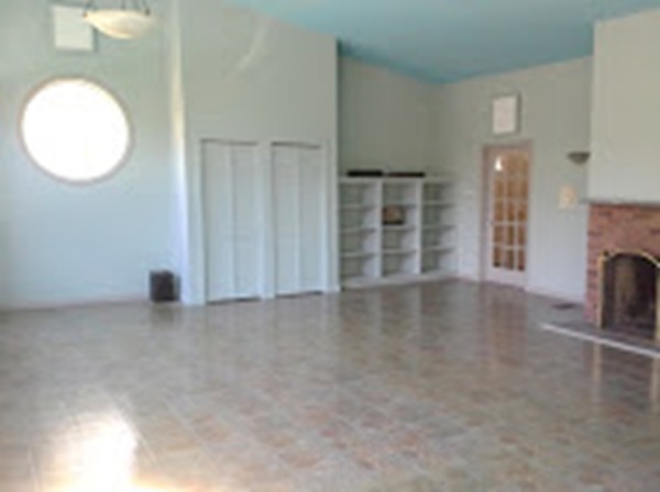 180 South Ashfield Road Conway, MA 01096 - Photo 4 of 30 an empty room with windows and fireplace