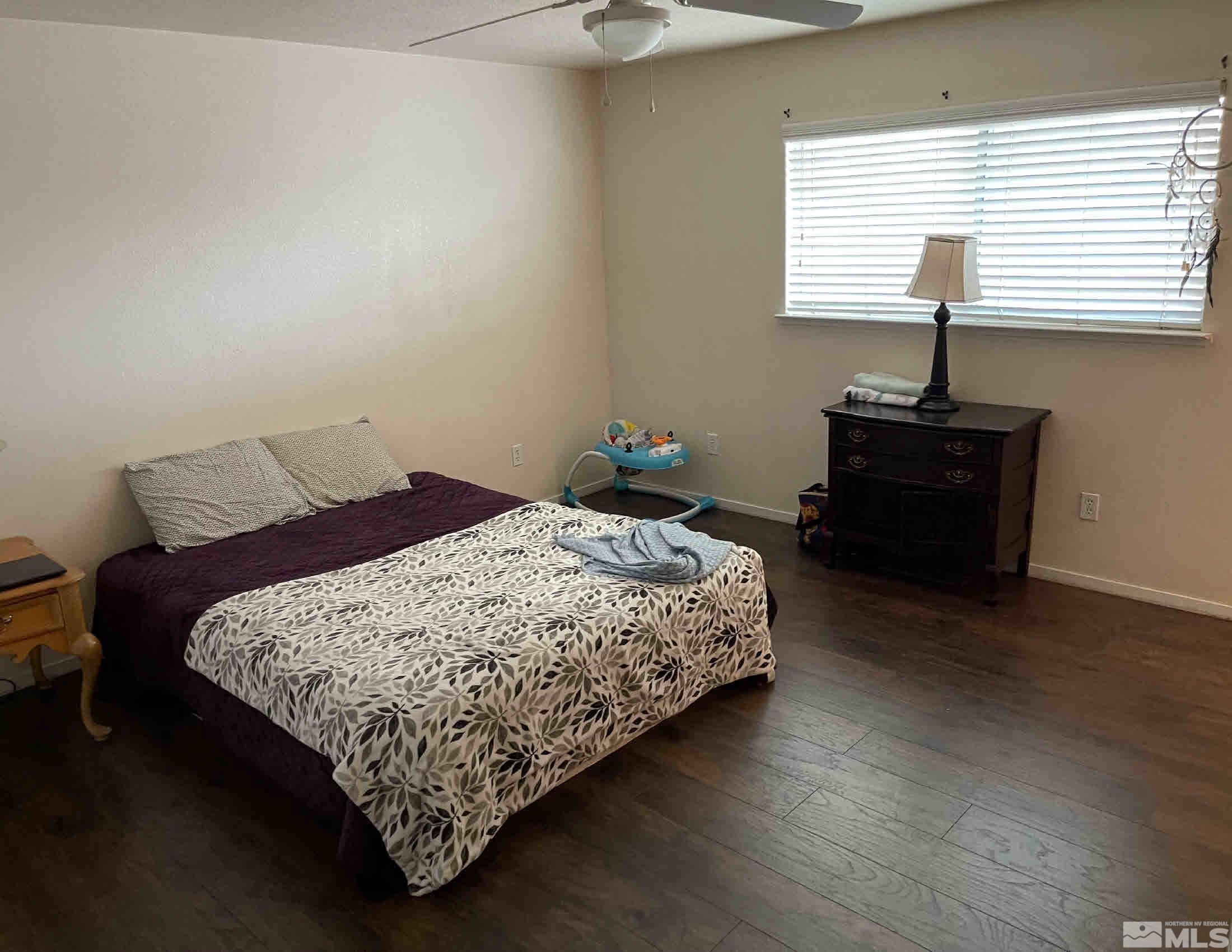 703 Empire Road Dayton, NV 89403 - Photo 13 of 31 a bedroom with a bed and a window