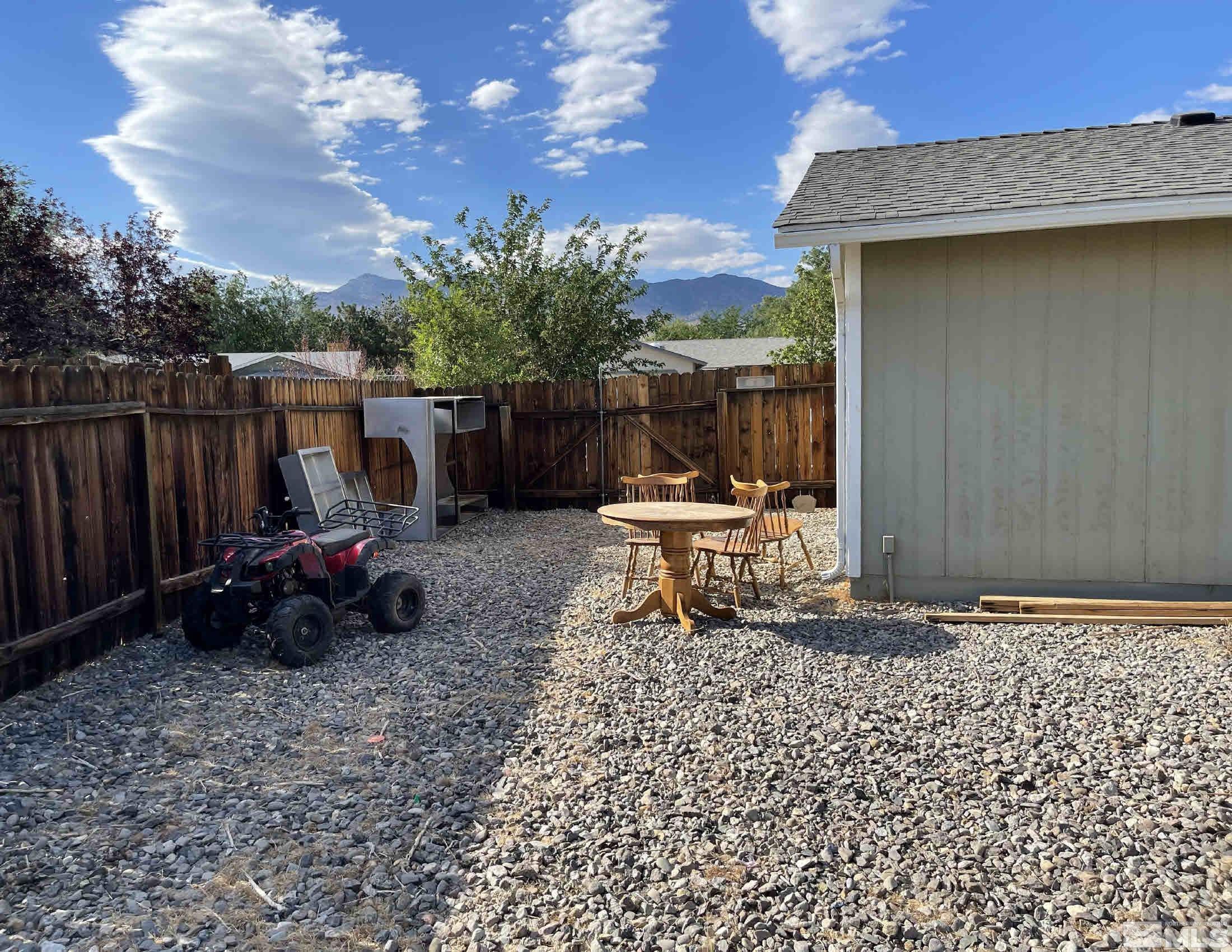 703 Empire Road Dayton, NV 89403 - Photo 20 of 31 a backyard of a house with table and chairs