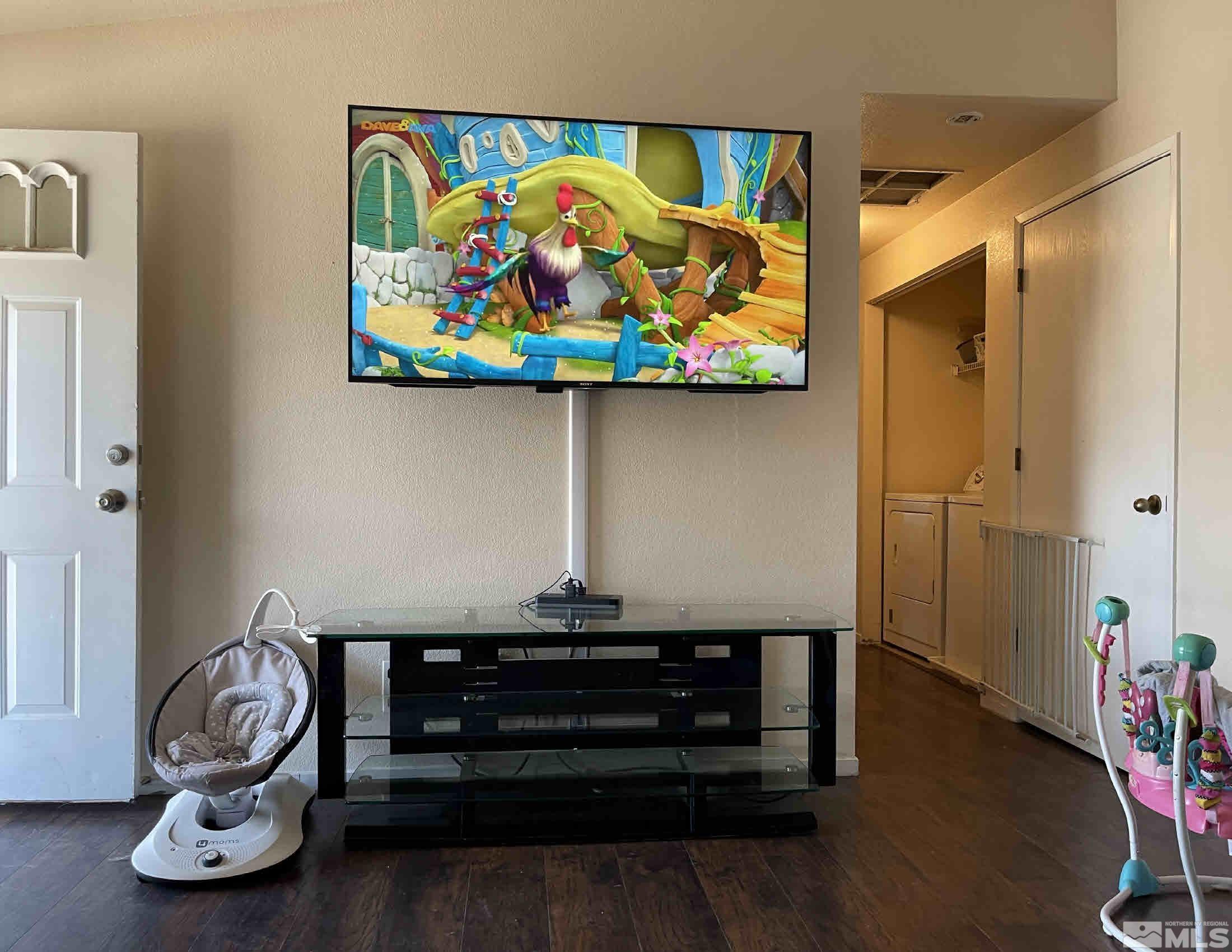 703 Empire Road Dayton, NV 89403 - Photo 3 of 31 a room with toys and wooden floor