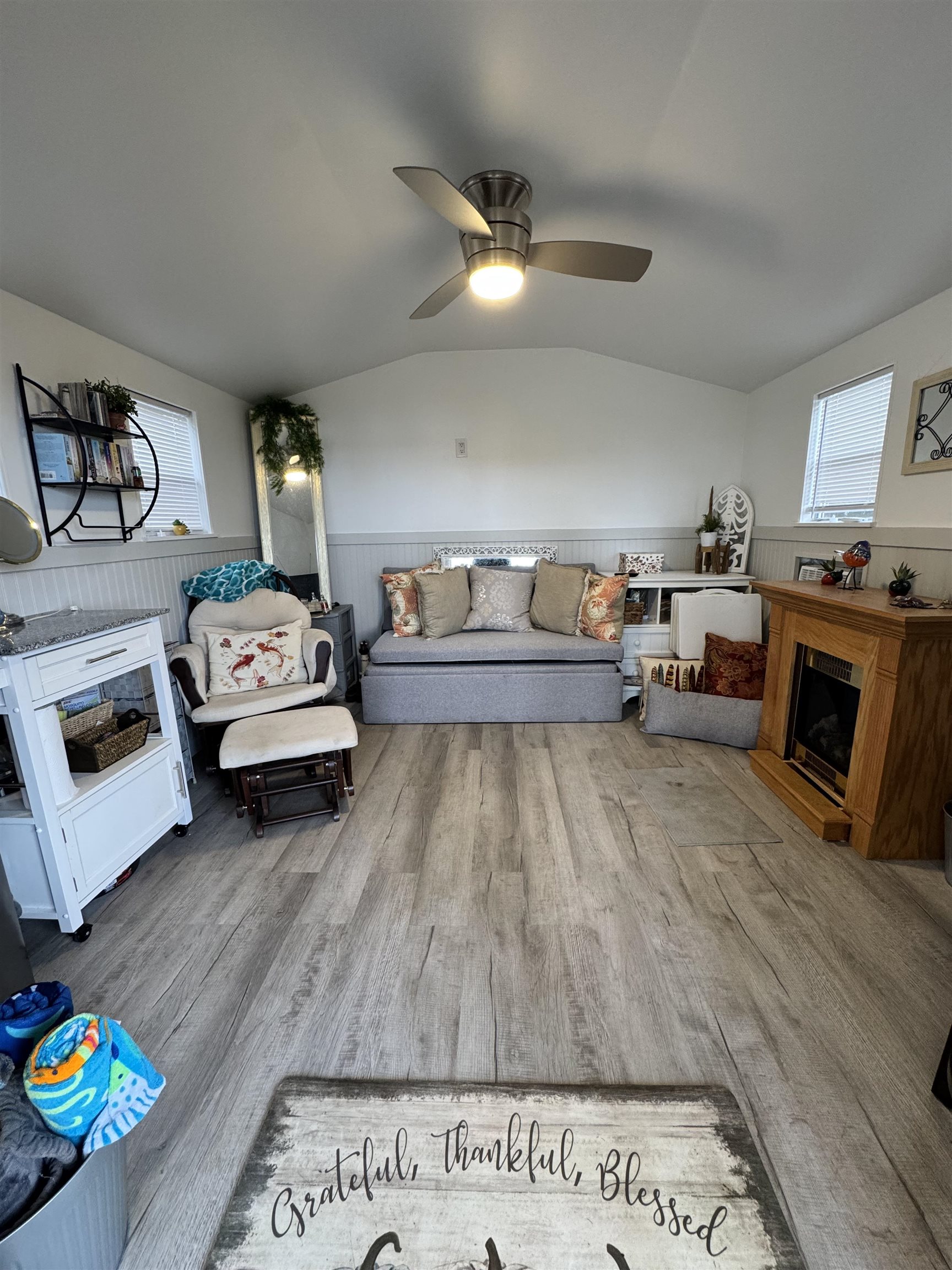 8550 Palmo Fish Camp Road, Unit 1 St. Augustine, FL 32092 - Photo 15 of 20 a living room with furniture and a fireplace