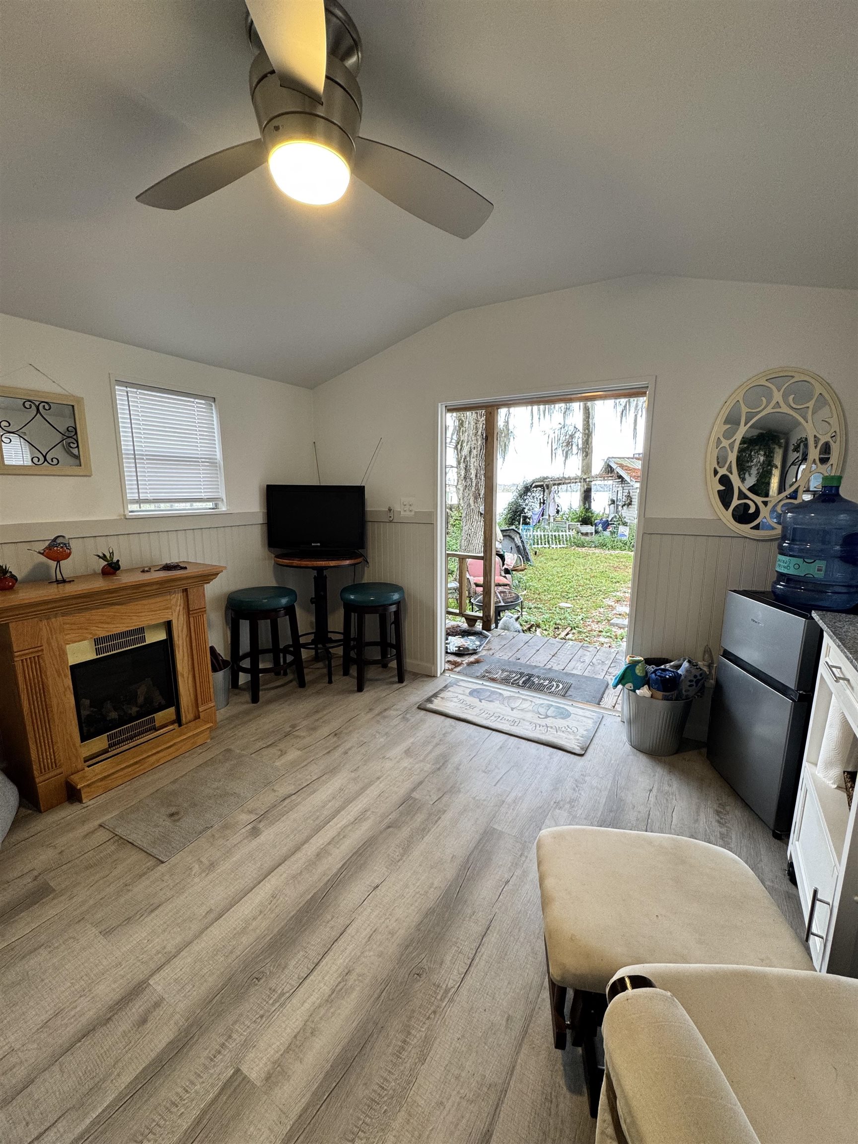8550 Palmo Fish Camp Road, Unit 1 St. Augustine, FL 32092 - Photo 16 of 20 a living room with furniture and a fireplace