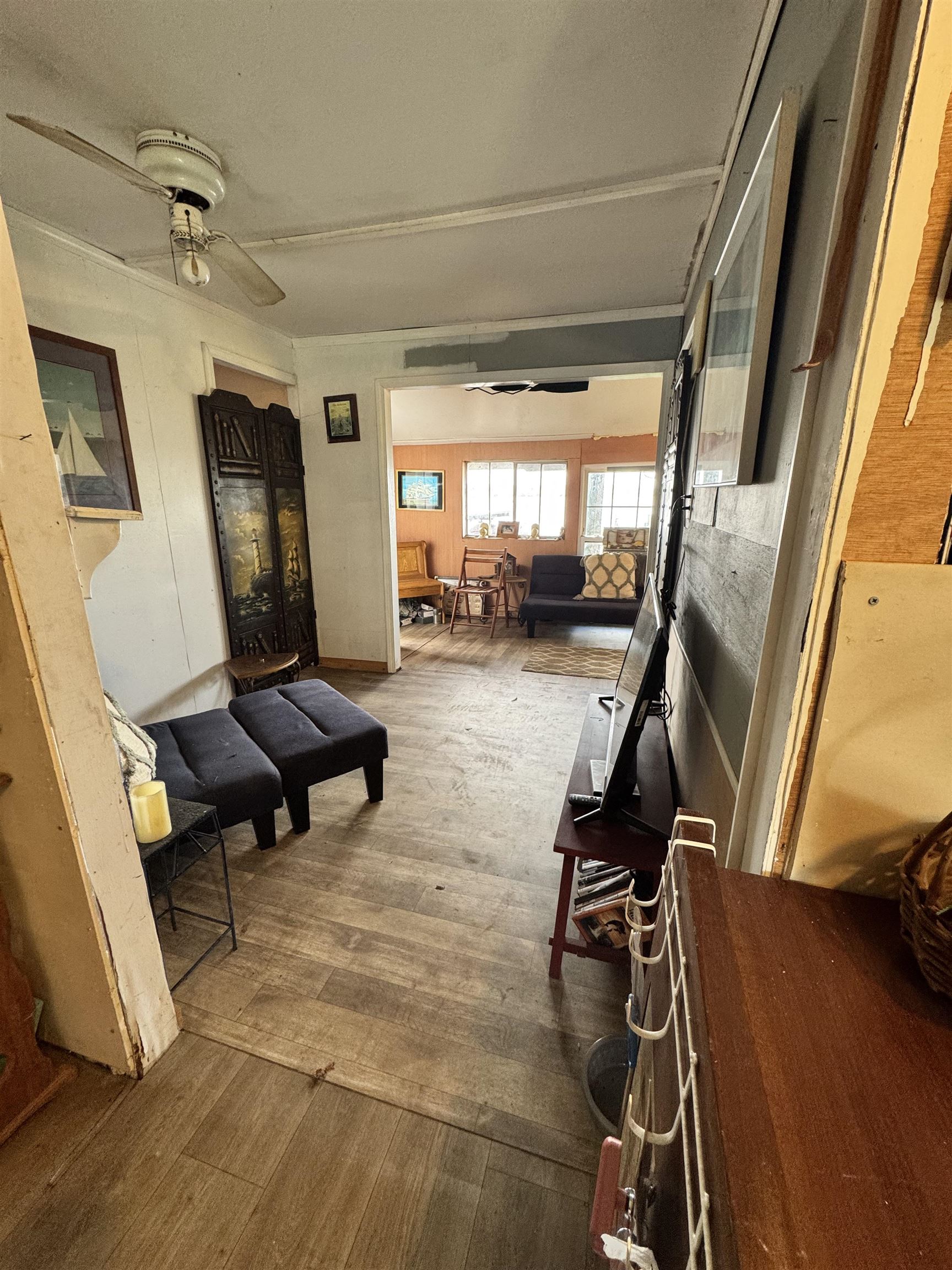 8550 Palmo Fish Camp Road, Unit 1 St. Augustine, FL 32092 - Photo 18 of 20 a living room with furniture and a wooden floor