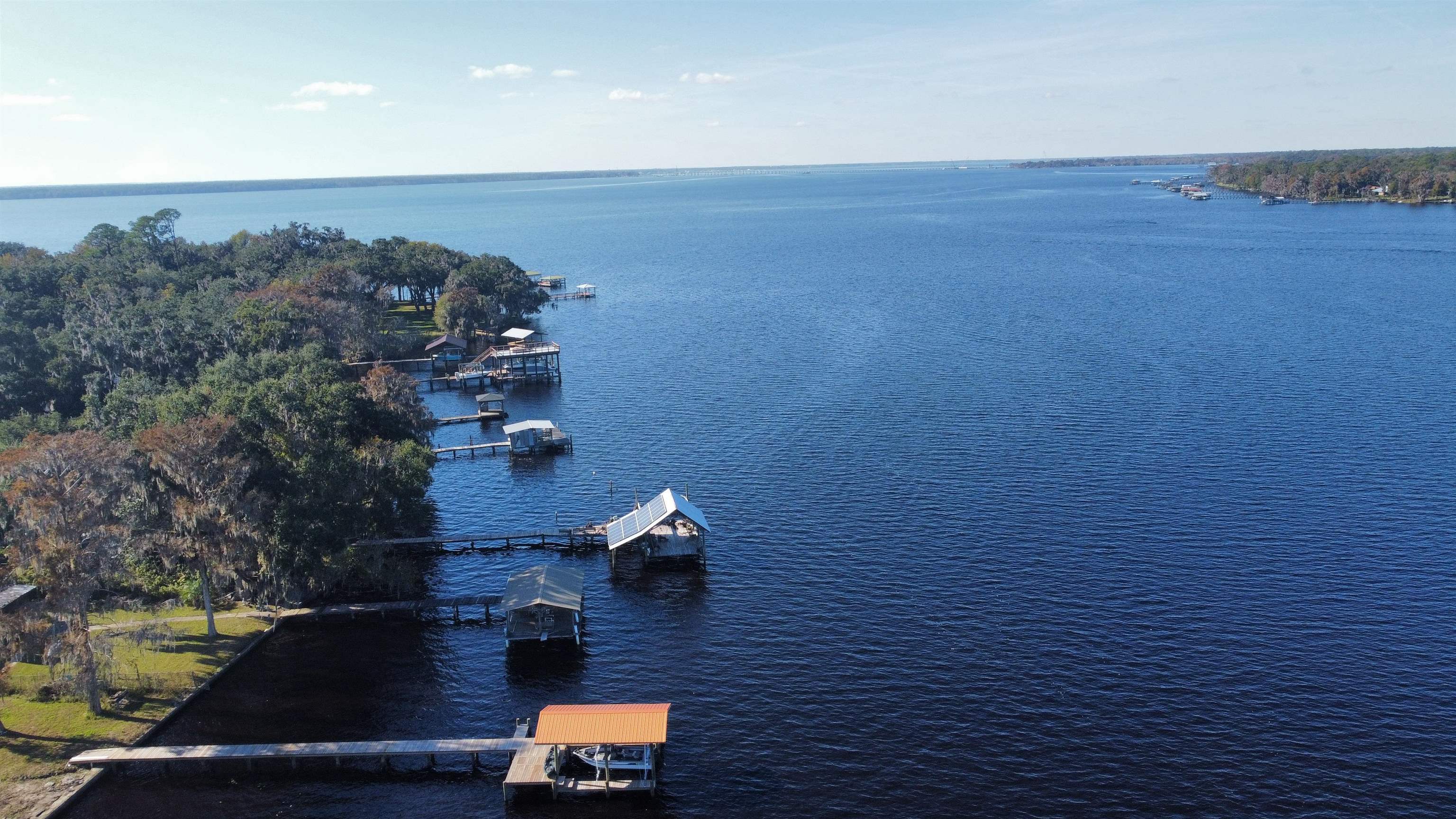 8550 Palmo Fish Camp Road, Unit 1 St. Augustine, FL 32092 - Photo 7 of 20 an aerial view of residential houses with outdoor space