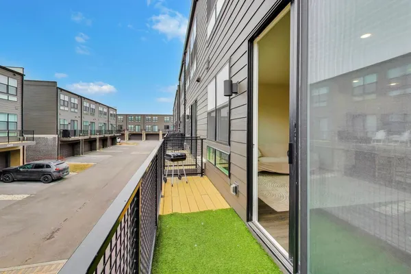 a view of a swimming pool with a balcony
