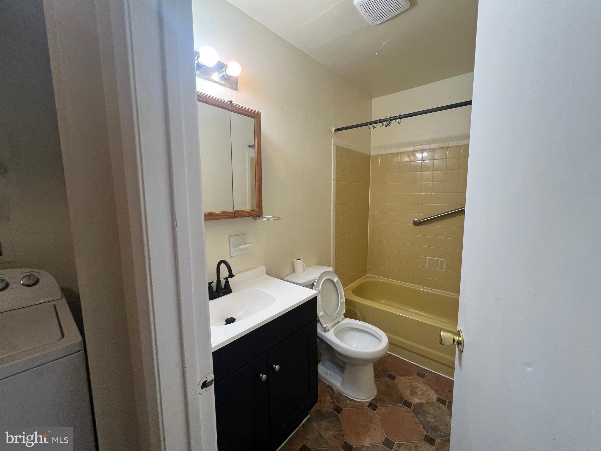 785 Jarvis Road, Unit A Sicklerville, NJ 08081 - Photo 6 of 10 a bathroom with a sink a toilet and shower a mirror