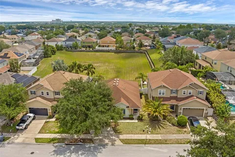 an aerial view of residential building and green space