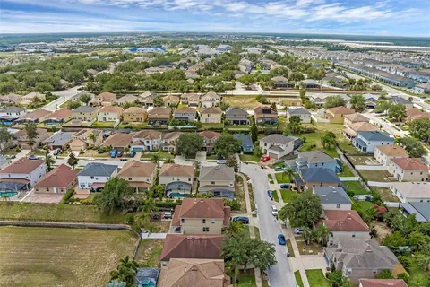 an aerial view of residential building with parking space