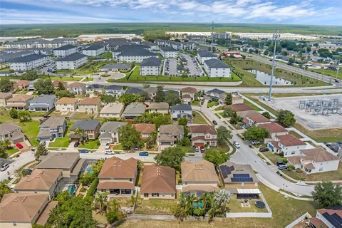 an aerial view of residential building with parking space