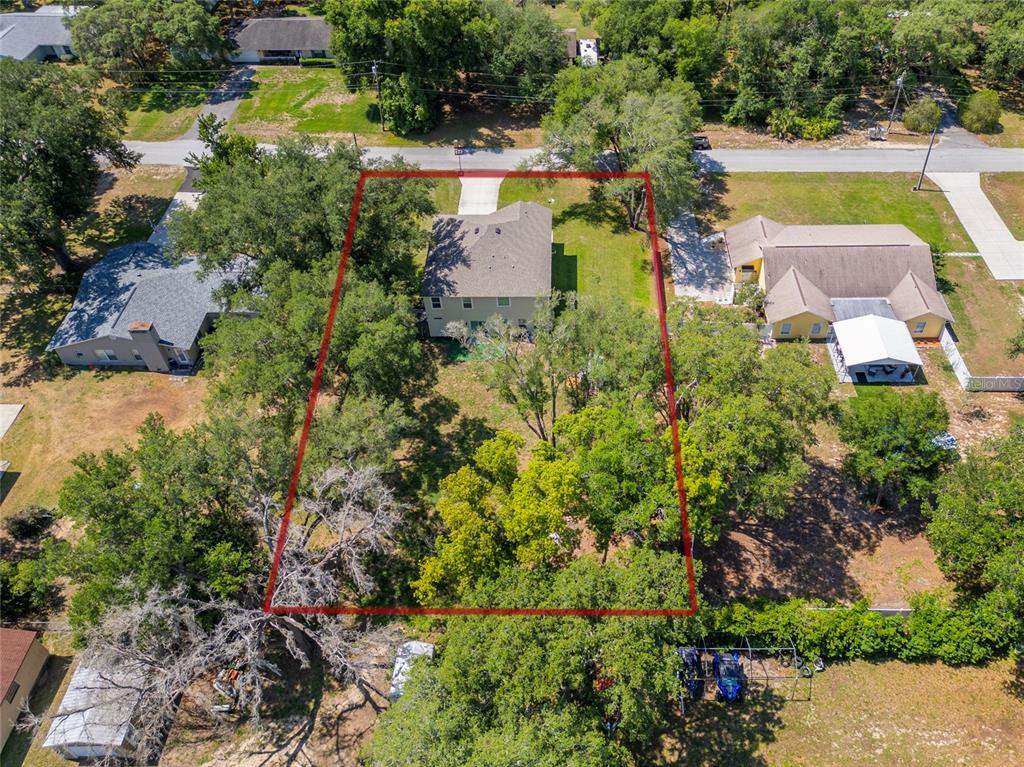 4331 Wayne Road Fruitland Park, FL 34731 - Photo 12 of 46 an aerial view of a house with a garden