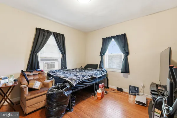 a bedroom with furniture and a window