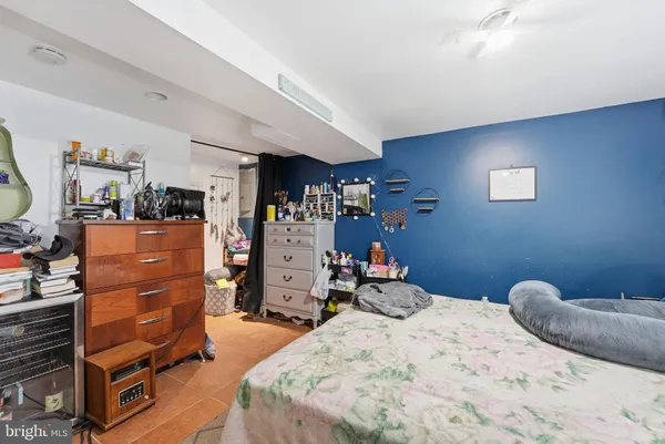 a bedroom with a bed and a closet