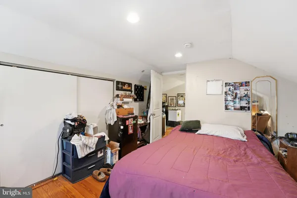 a bedroom with a bed and a desk