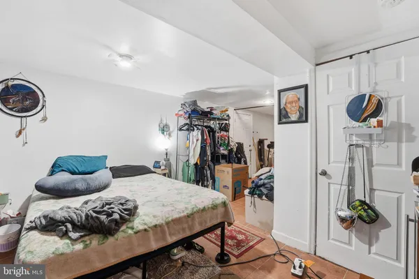 a bedroom with furniture and a chandelier