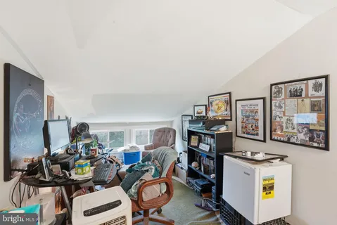 a view of a workspace with furniture and toys