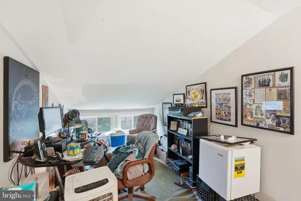 a view of a workspace with furniture and toys