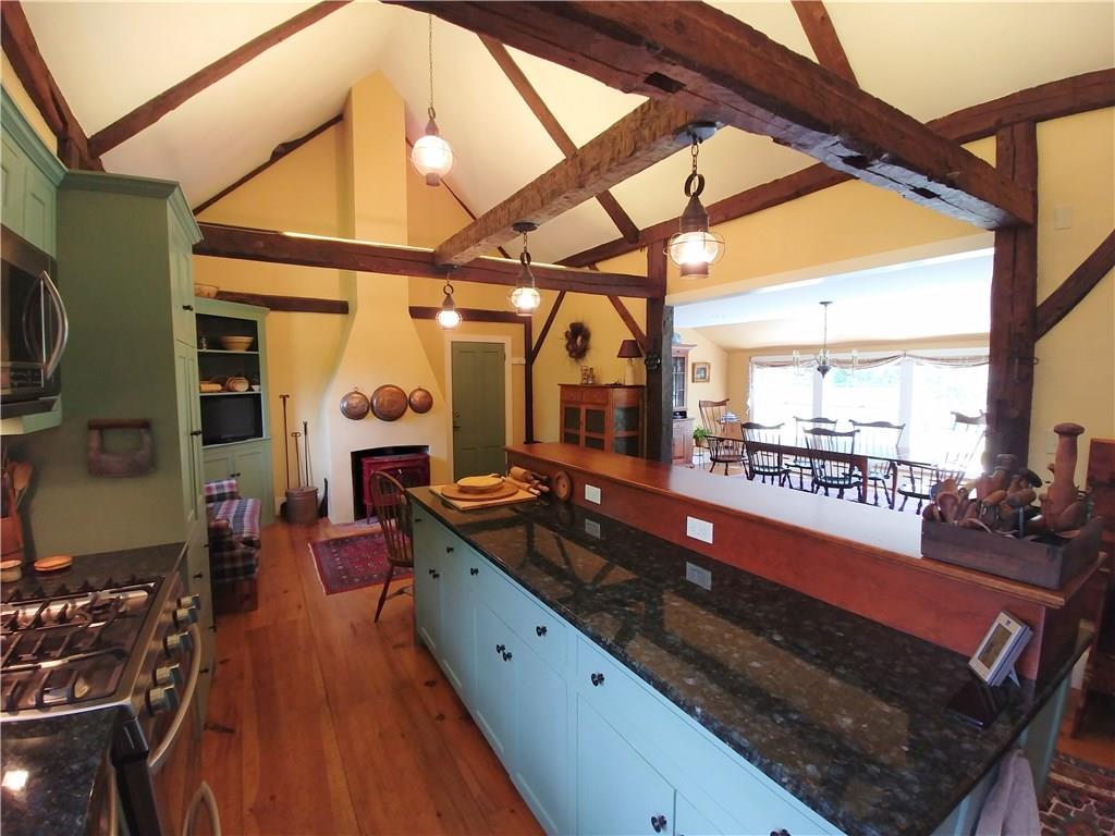 79 Moxie Cove Road Round Pond, ME 04564 - Photo 4 of 35 Custom kitchen cabinets with woodstove.