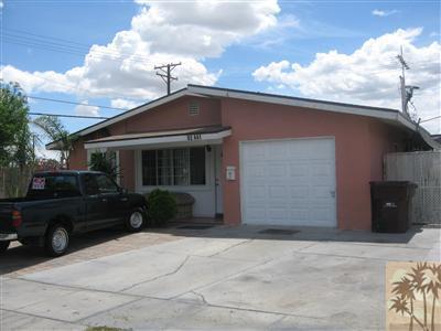 82441 Adobe Road Indio, CA 92201 - Photo 1 of 1 a front view of a house with a yard
