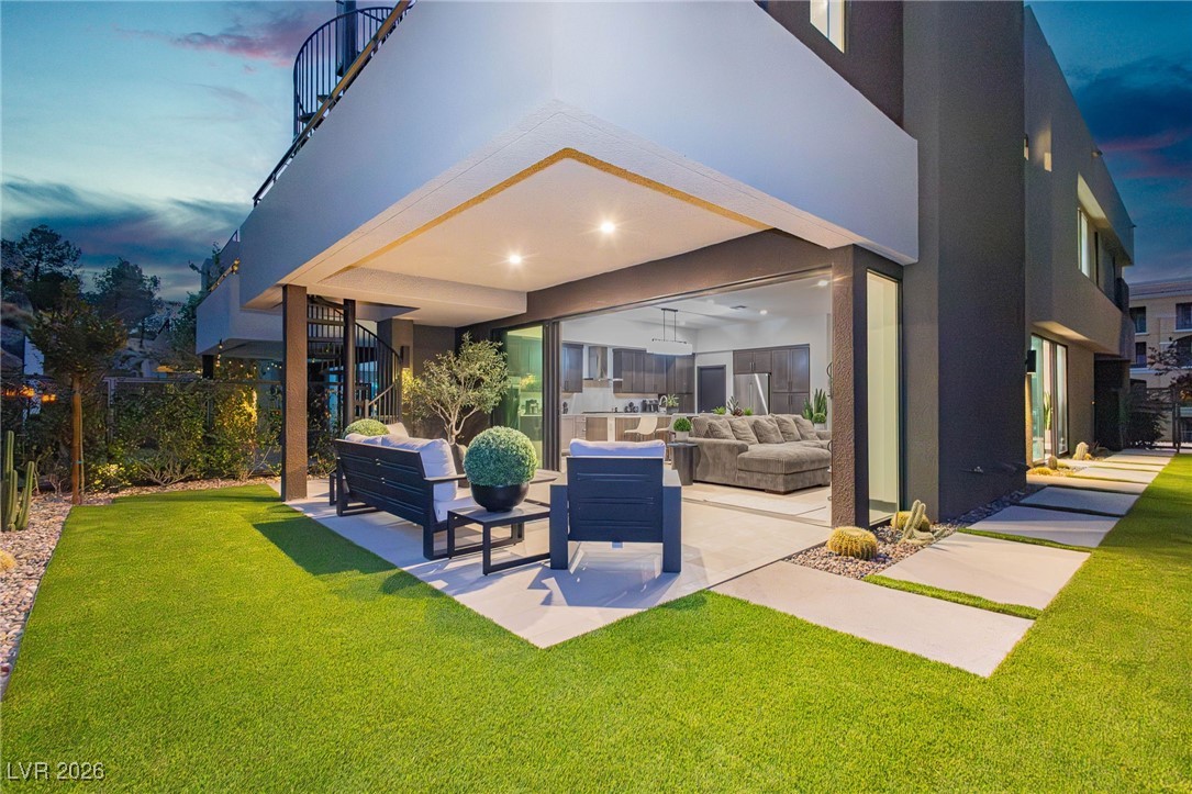 13 Promenade Isle Lane Henderson, NV 89011 - Photo 37 of 52 Covered Patio with yard
