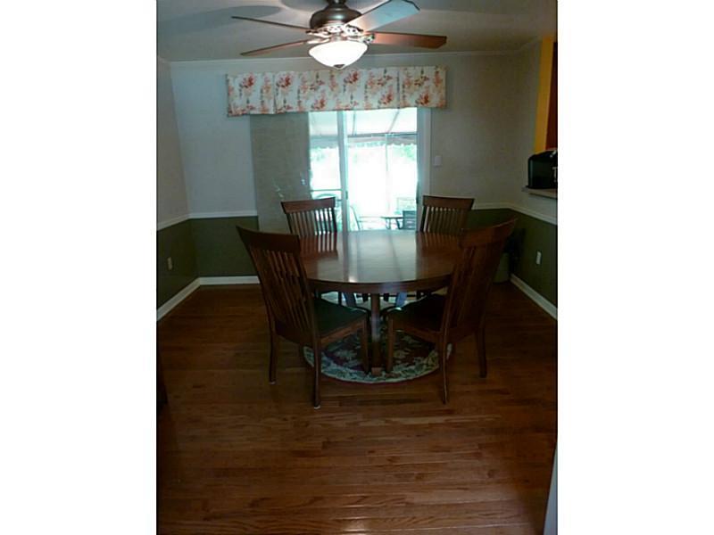15 Spring Run Road Greensburg, PA 15601 - Photo 6 of 25 Dining Room. Hardwood floors. Sliding glass doors lead to a cement patio with an awning.