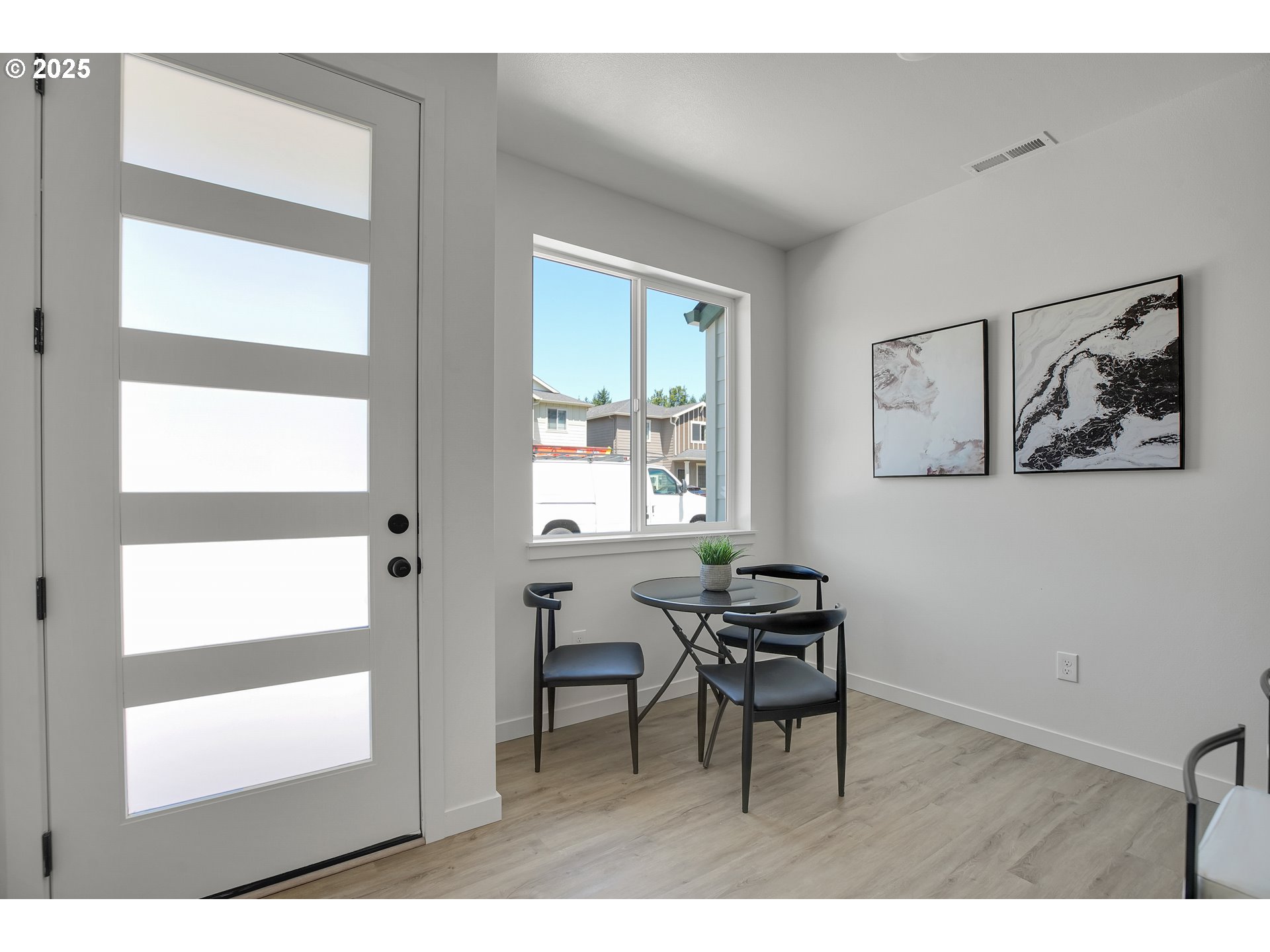 14816 Northeast Couch Street, Unit 3 Portland, OR 97230 - Photo 14 of 42 a view of a workspace with furniture and a window