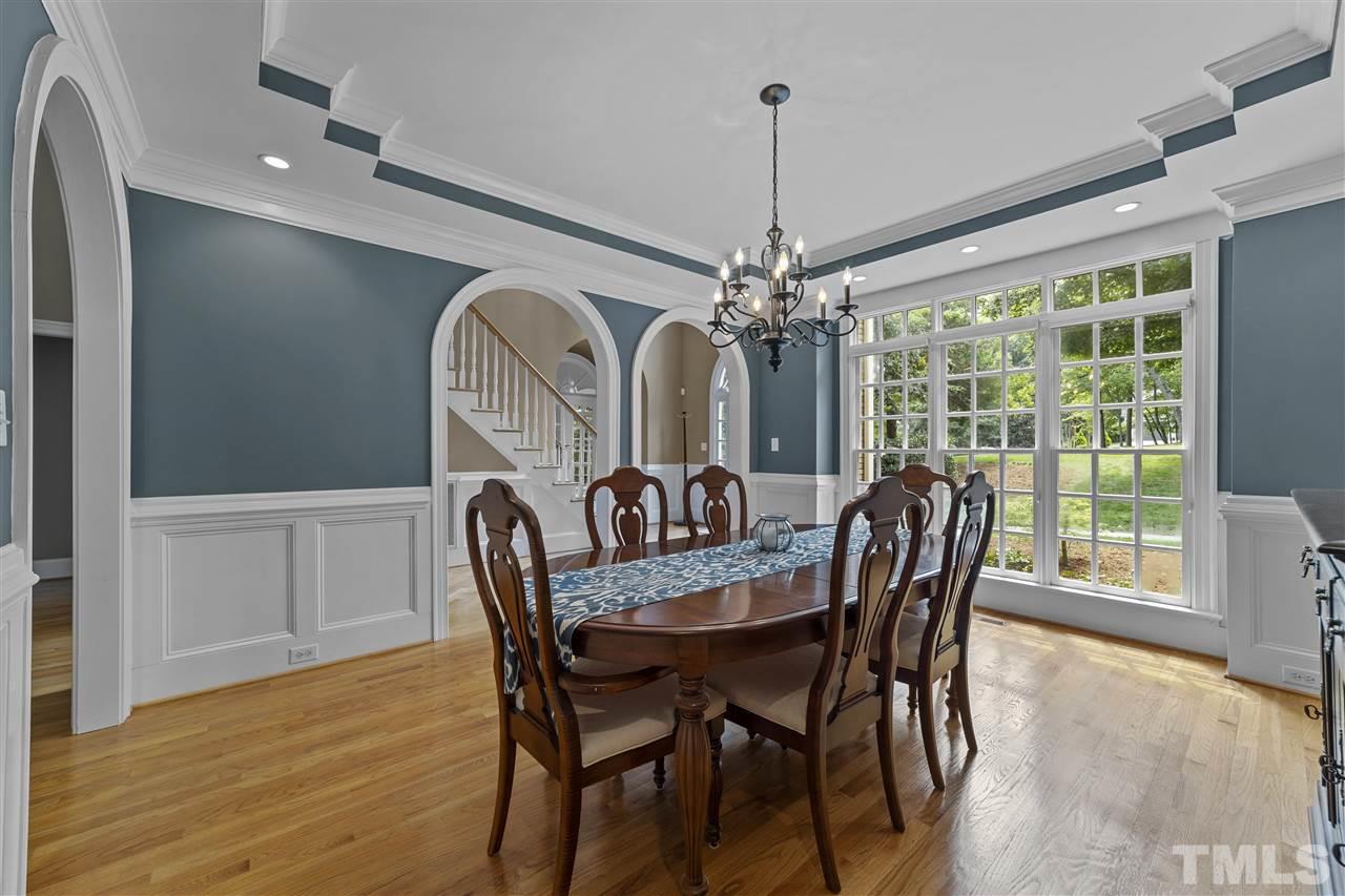 1126 Stonebridge Drive Durham, NC 27712 - Photo 14 of 29 a view of a dining room with furniture window and wooden floor