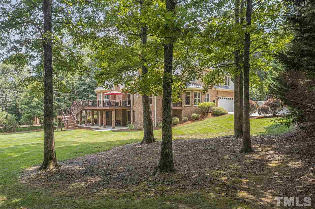 1126 Stonebridge Drive Durham, NC 27712 - Photo 9 of 29 a view of a house with backyard and trees