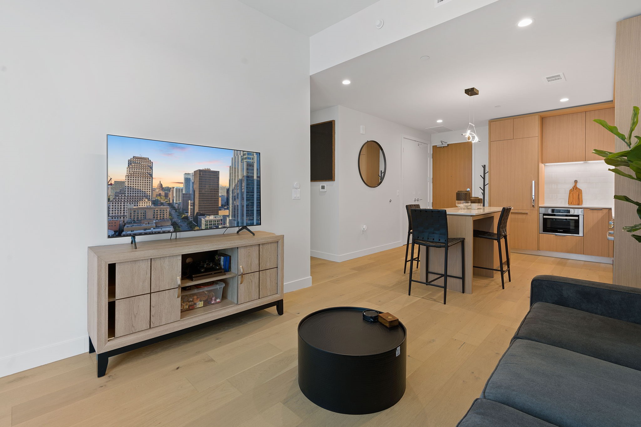44 East Avenue, Unit 1902 Austin, TX 78701 - Photo 11 of 40 a living room with furniture and a flat screen tv