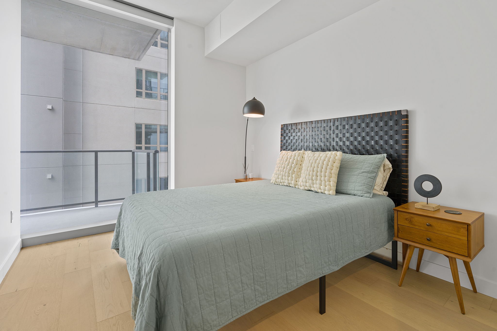 44 East Avenue, Unit 1902 Austin, TX 78701 - Photo 13 of 40 a bedroom with a bed and chair
