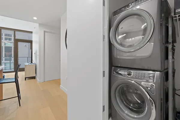 a view of a hallway with washer and dryer