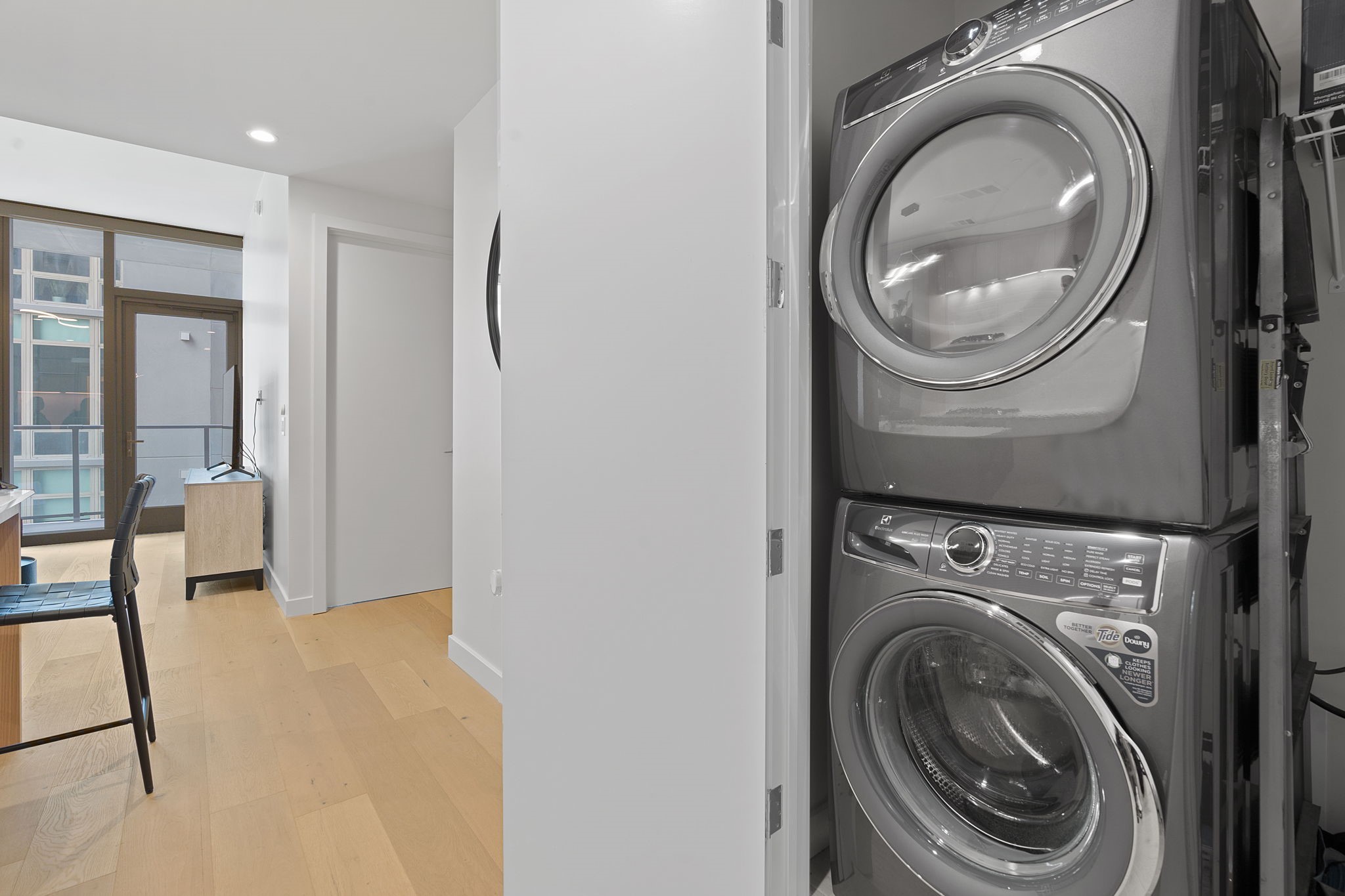 44 East Avenue, Unit 1902 Austin, TX 78701 - Photo 16 of 40 a view of a hallway with washer and dryer