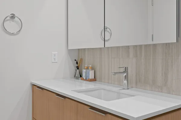 a bathroom with a bathtub a sink and a shower