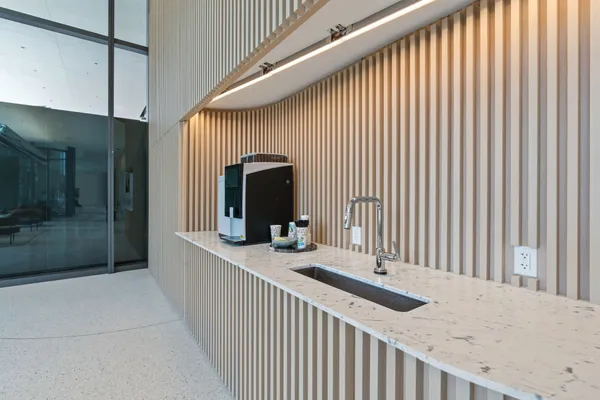 a balcony with table and chairs