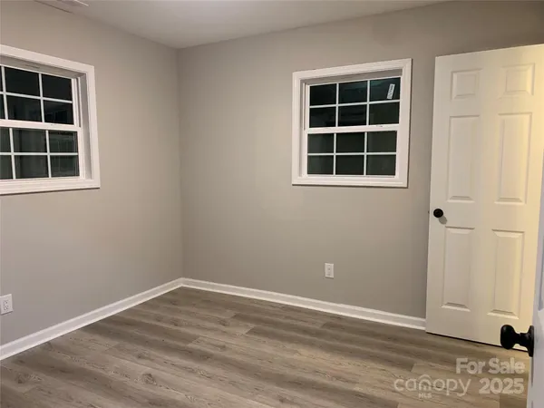 a view of empty room with windows