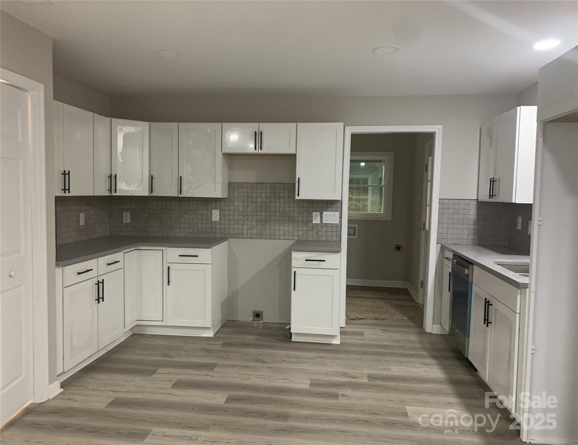 501 Colony Road Monroe, NC 28112 - Photo 2 of 14 a kitchen with stainless steel appliances granite countertop a stove a sink and a refrigerator
