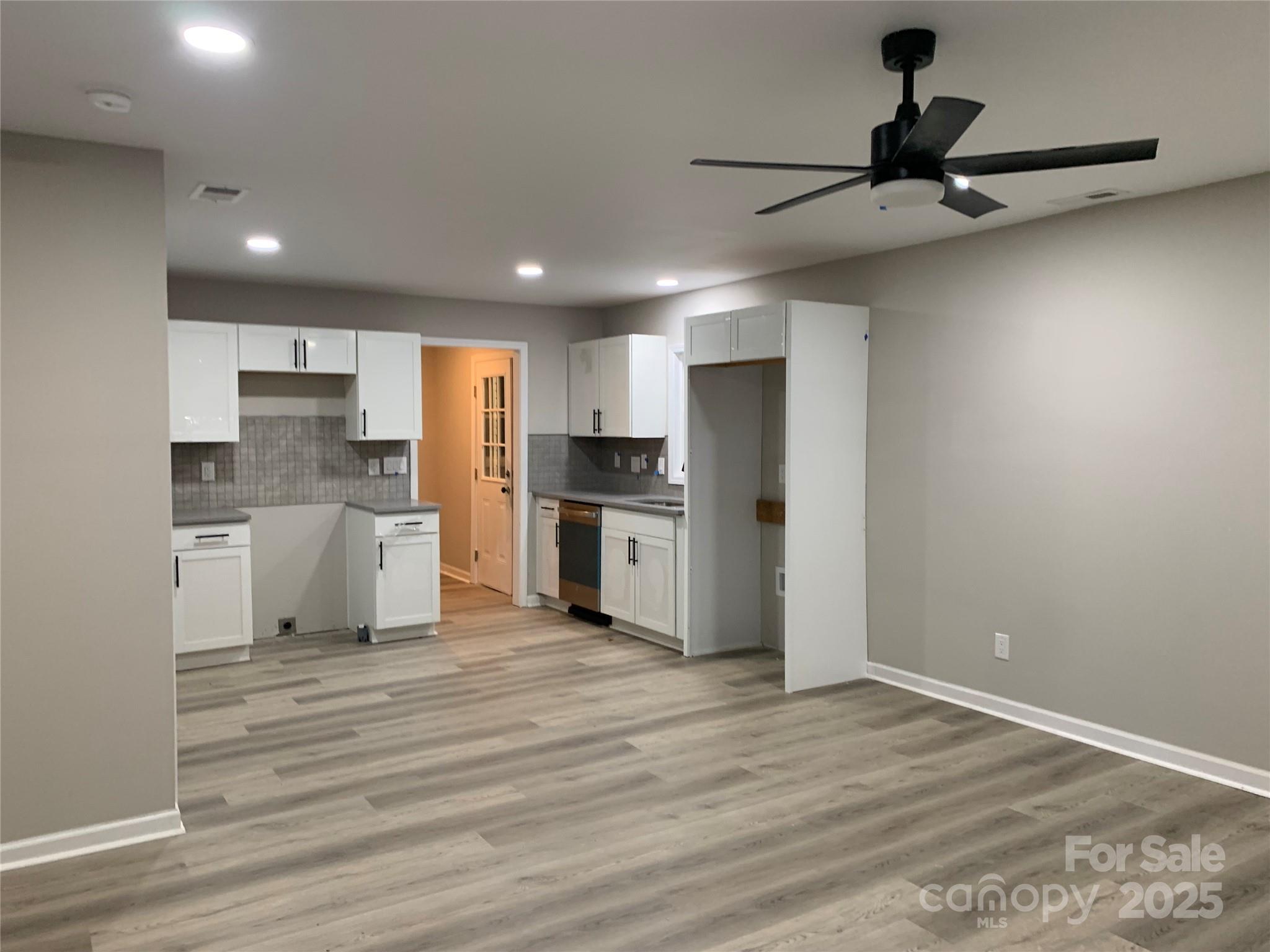 501 Colony Road Monroe, NC 28112 - Photo 4 of 14 a view of kitchen with wooden floor