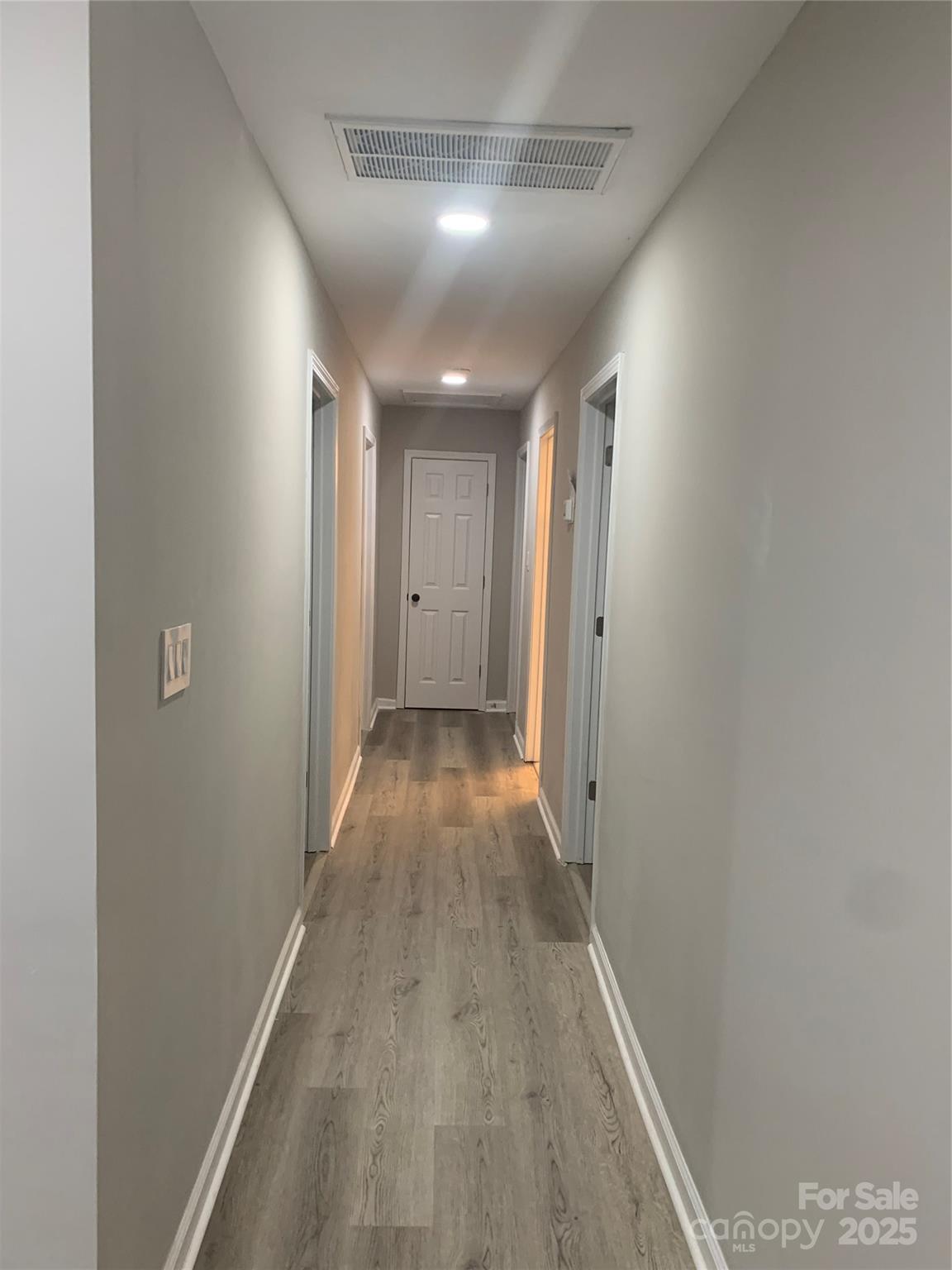 501 Colony Road Monroe, NC 28112 - Photo 5 of 14 a view of hallway with wooden floor