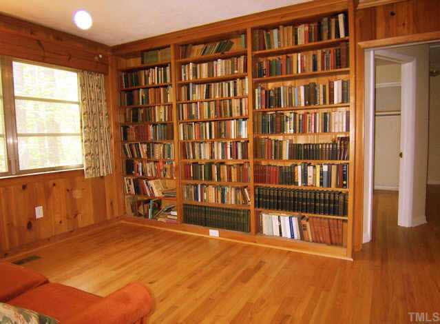 309 West Cornwallis Road Durham, NC 27707 - Photo 4 of 10 Study with built-in bookshelves, a pocket door and perfect spot for a television.