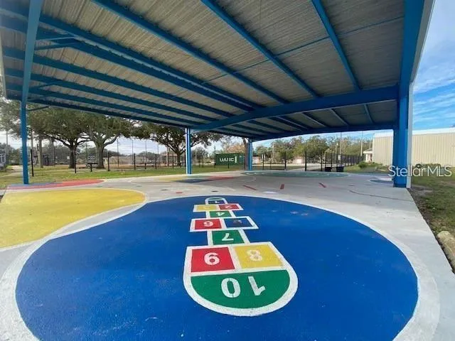 a view of a swimming pool with an outdoor space and seating area